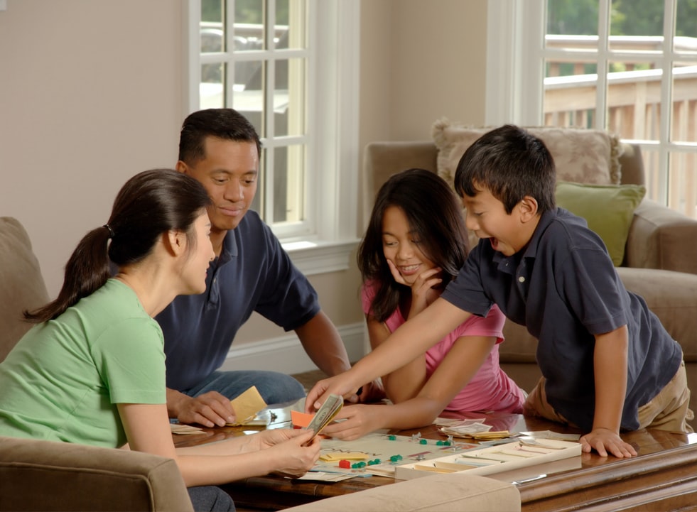 A family playing game in the living rooms