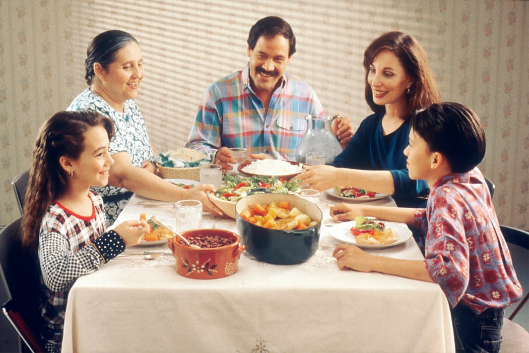 A family eating on a dining table