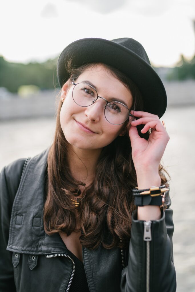 Positive lady readjusting her glassses